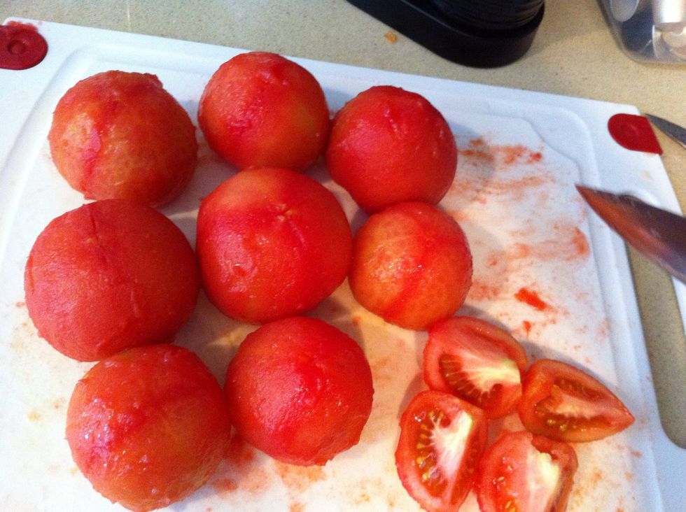 Cut each tomato into quarters