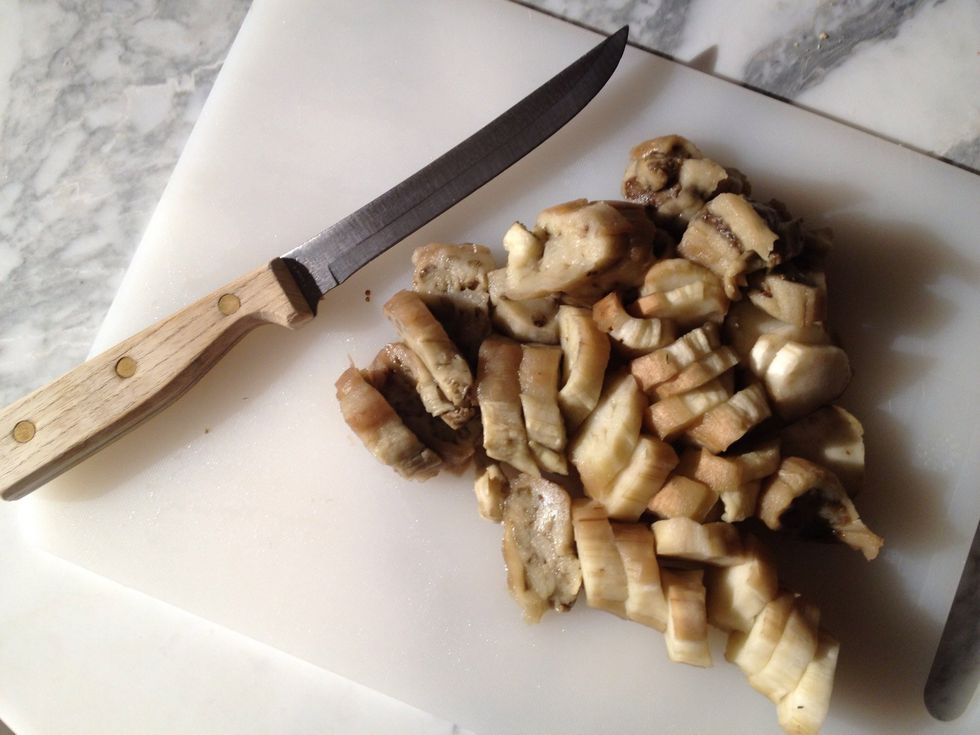 Cut eggplants into chunks in order to easily fit into your food processor. Pulse in food processor. If you don't have a food processor you can finely chop the eggplant.