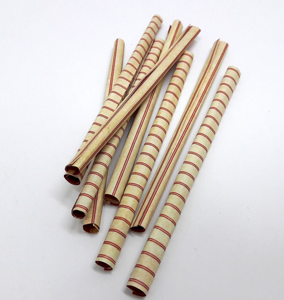 Cut eight 3 1/2" x 1" squares from DIY Craft paper and roll them. Attach the edges of rolled papers with glue.