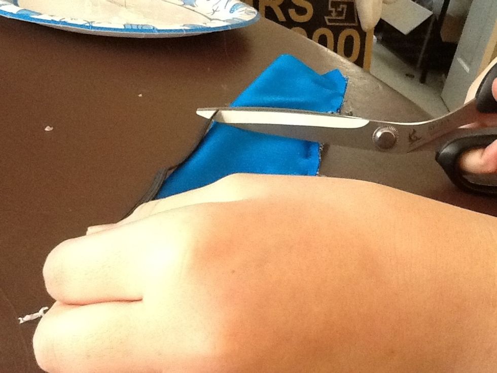 Cut elastic cord half the length of the fabric