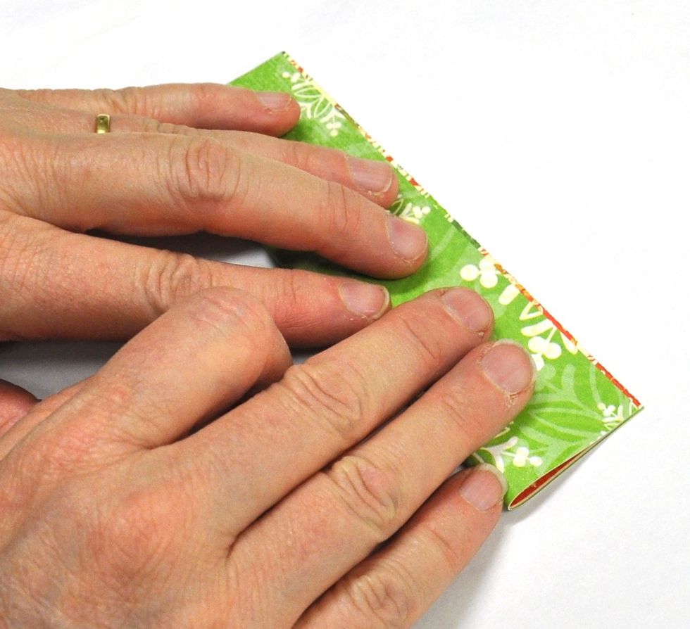 Cut five 3x5 inch rectangles from your sheet of "Ho Ho Ho" and fold them in half longways.