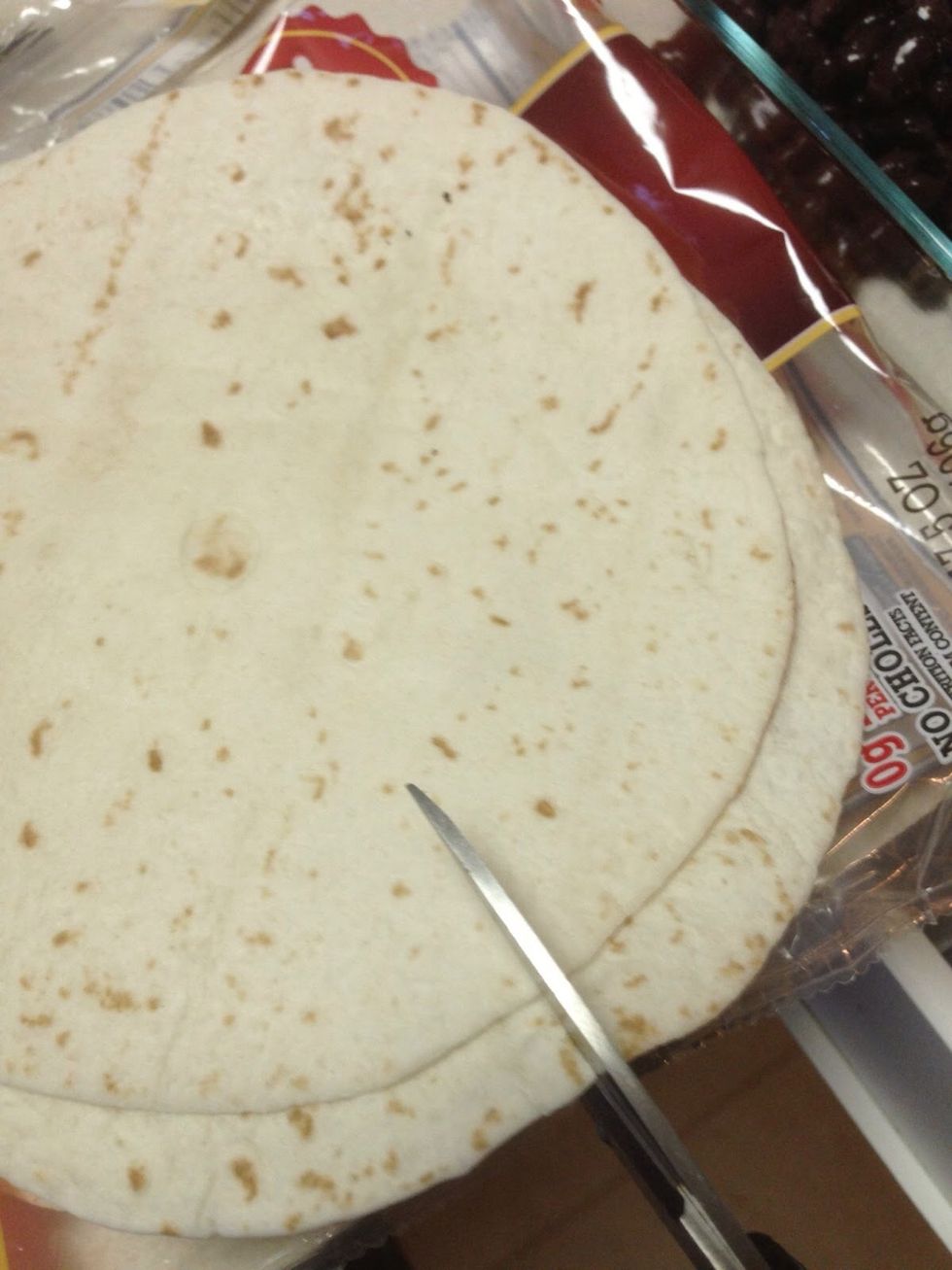 Cut flour tortillas in half.