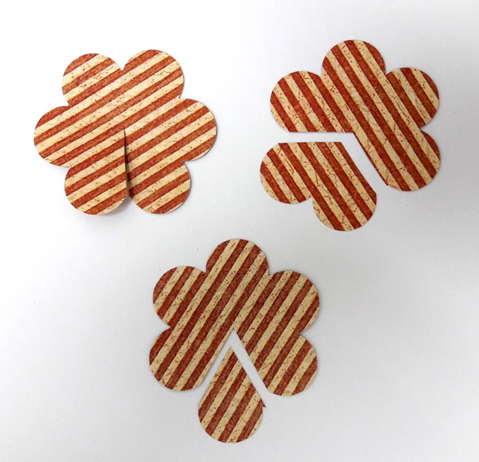 Cut flowers according to photo: 1) (left) slit between two petals to the center. 2) (right) Cut out two petals. 3) (Bottom) Cut out one petal.