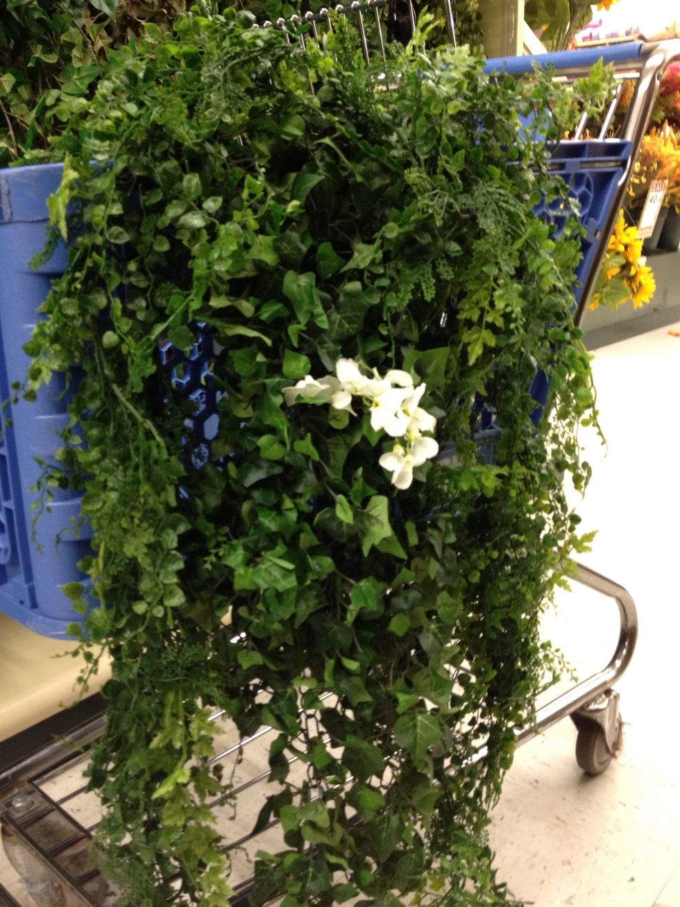 Cut flowers from "White Double Ruffle Garland 719344" and wire to array as desired.