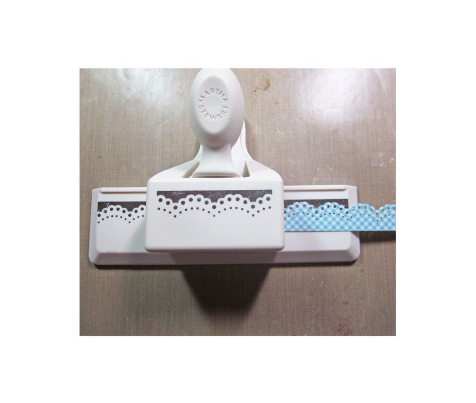 Cut four strips of paper using a Martha Stewart punch,