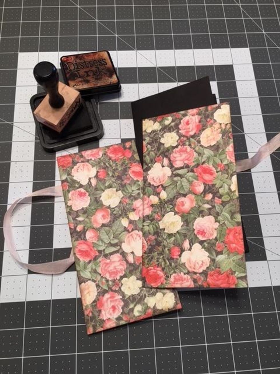 Cut from Dearest Darling  1 piece @ 3 3/4" wide x 7 5/8" tall and 1 piece @ 4" wide x 7 5/8" tall. Ink edges and glue to the outside covers, front & back. Make sure to cover the ribbon on the back.