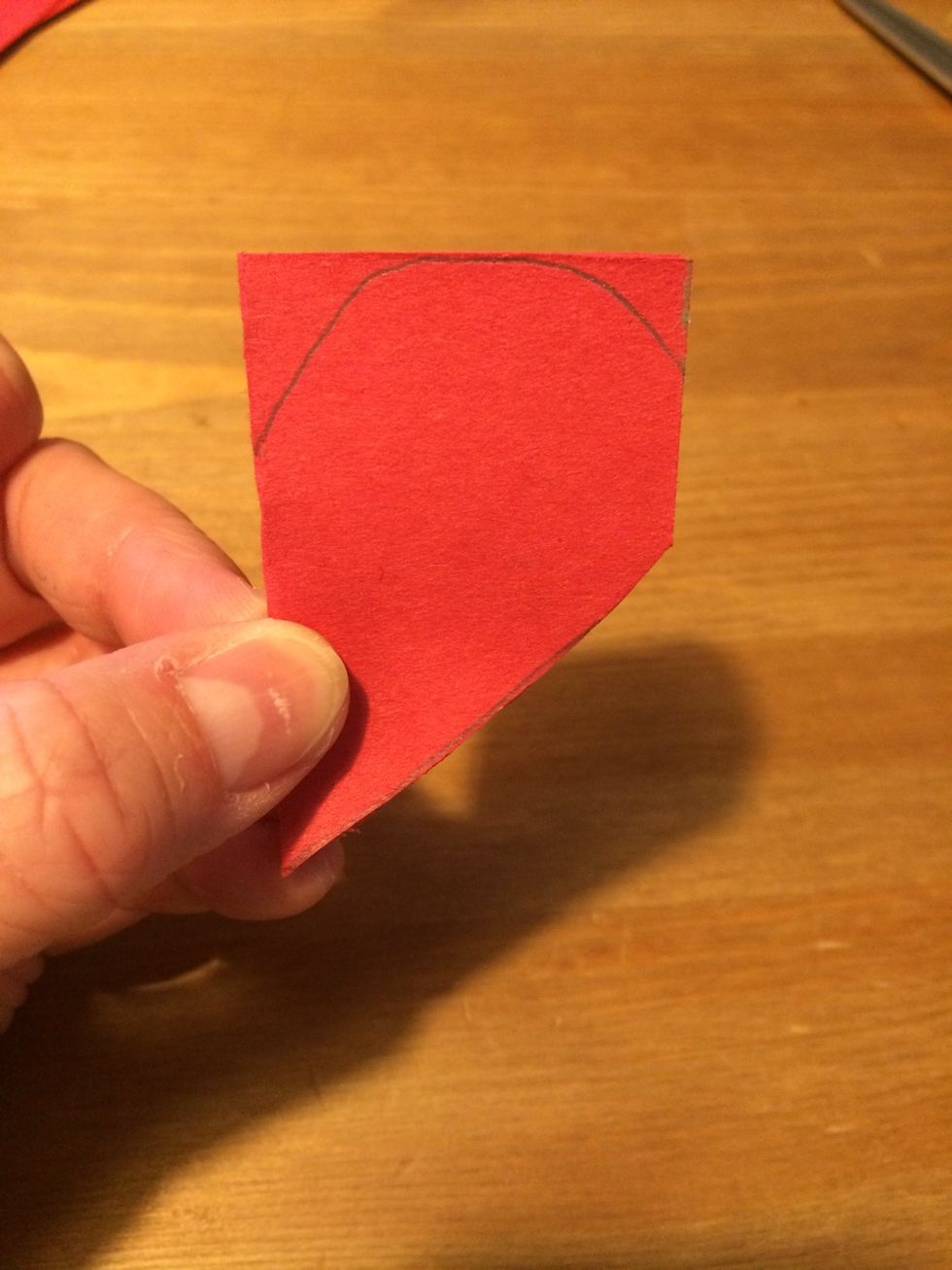 Cut from the bottom point to the right edge of the heart.