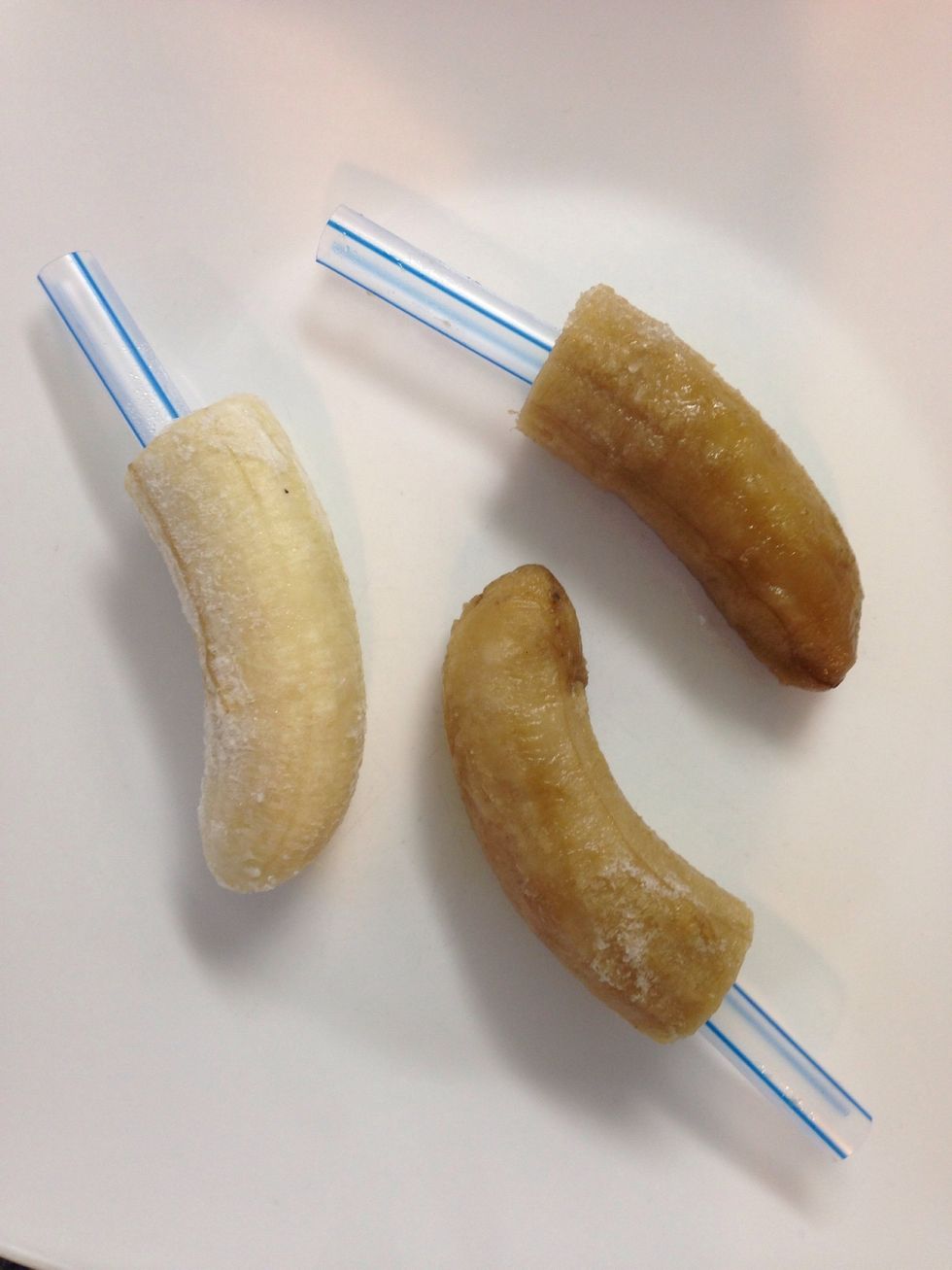 Cut frozen bananas in half and put onto Popsicle sticks or thick plastic straws