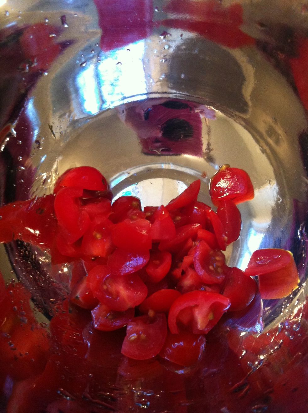 Cut grape tomatoes in small pieces