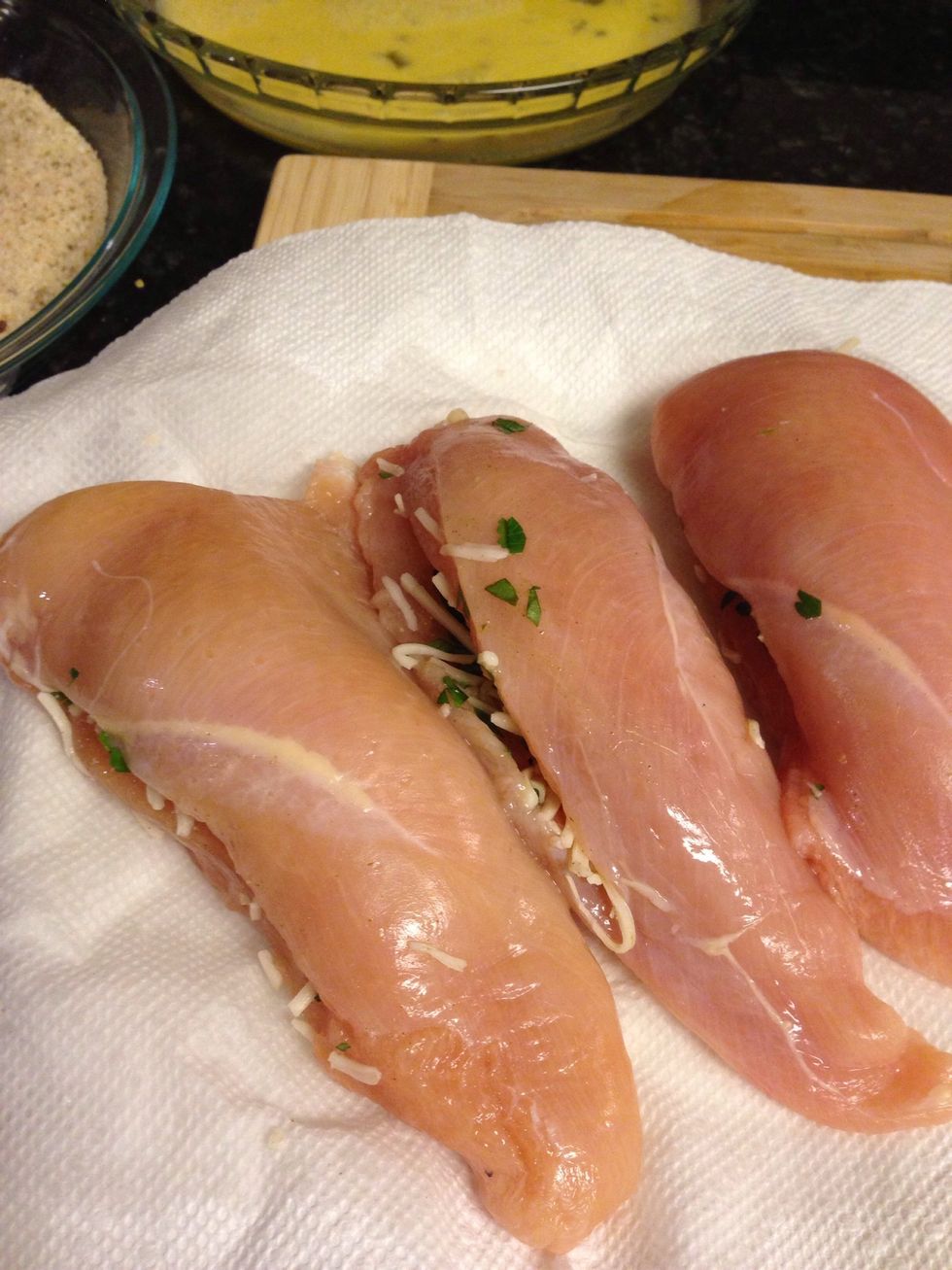 Cut horizontal slices into the center of the chicken cutlets, creating small pockets in each. Stuff the chicken with the mozzarella parsley mixture.