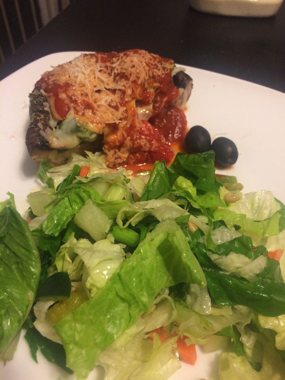 Cut in half, add pizza sauce on top and Parmesan cheese, serve with salad