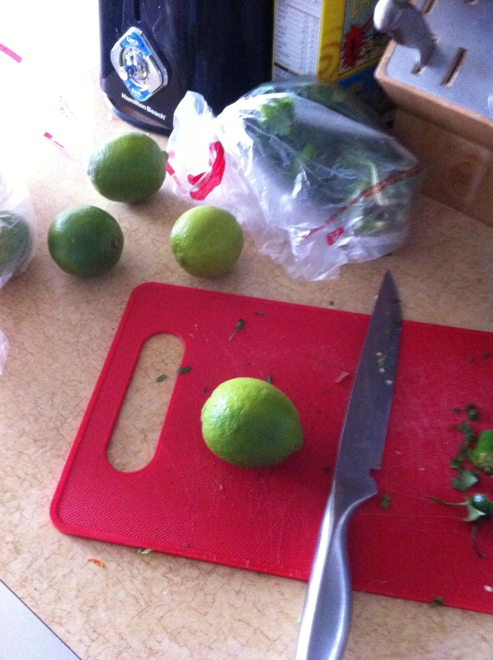 Cut in half and squeeze the lime juice into the platter so the fish is barely drowning in it