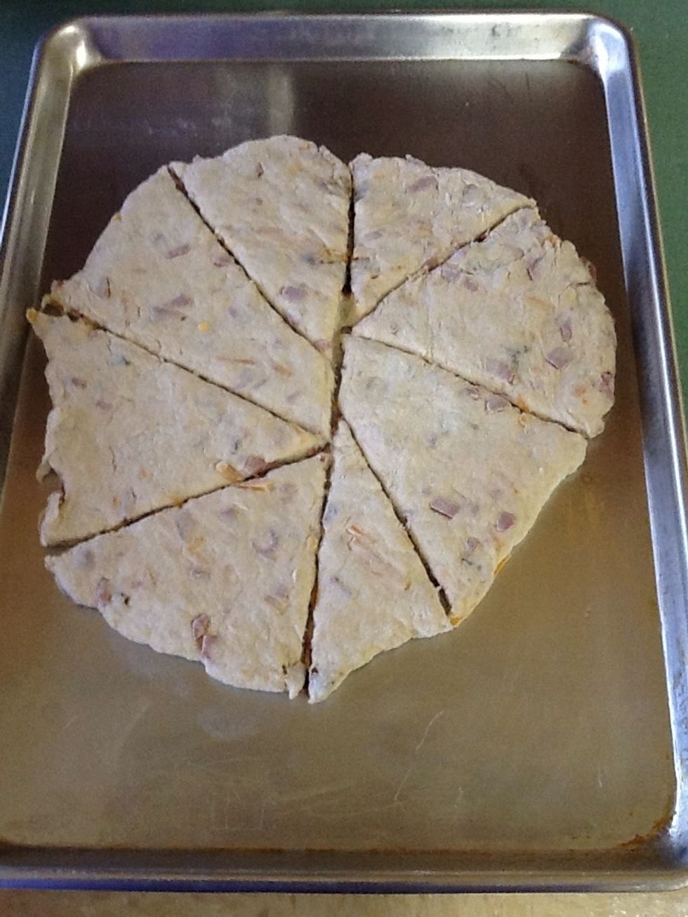 Cut in to 8-12 pieces and pre heat oven to 400 degrees and cook for 15 minutes or till golden brown.