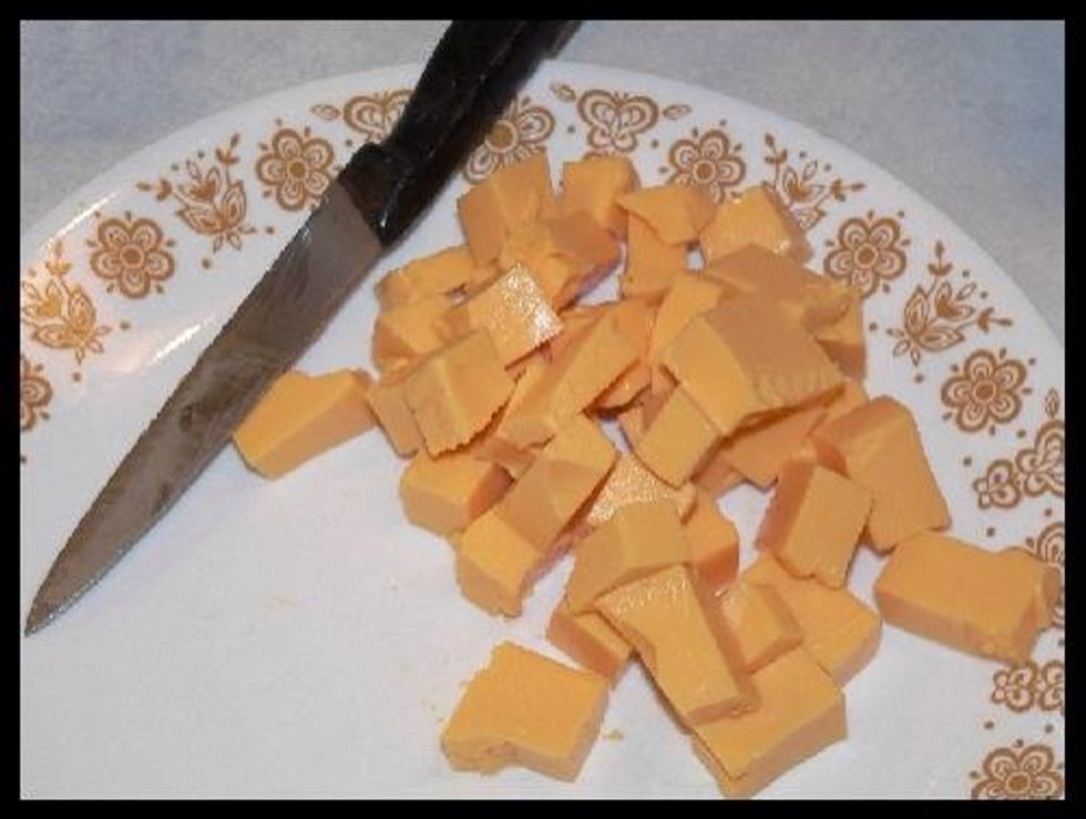 Cut in to cubes, 1 cup of Velveeta processed cheese. I usually start with 1 cup of Velveeta and if needed will add another 1/2 cup of cheese. Just depends on the consistency that you are after. 16