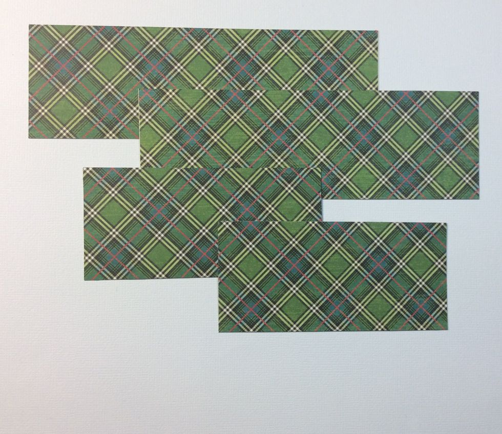 Cut internal mats for the book box. Two at 4 1/4 x 2 inches, two at 6 1/4 x 2 inches and one at 6 1/4 x 4 1/4 inches. These mats will leave a small boarder on each side. Use same paper as chip board.