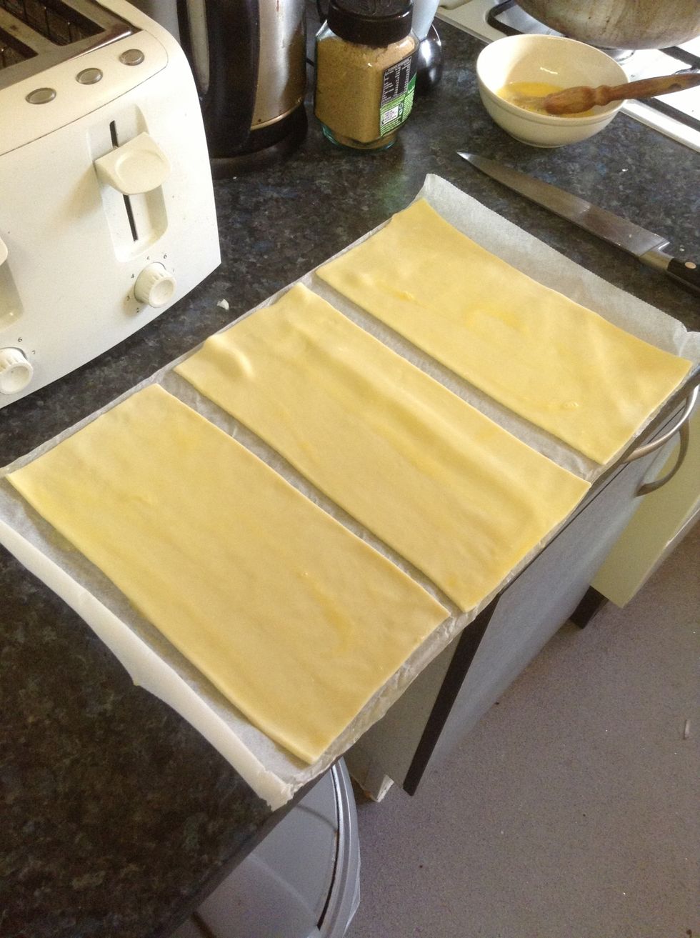 Cut into 3 even pieces and brush with egg wash until evenly coated