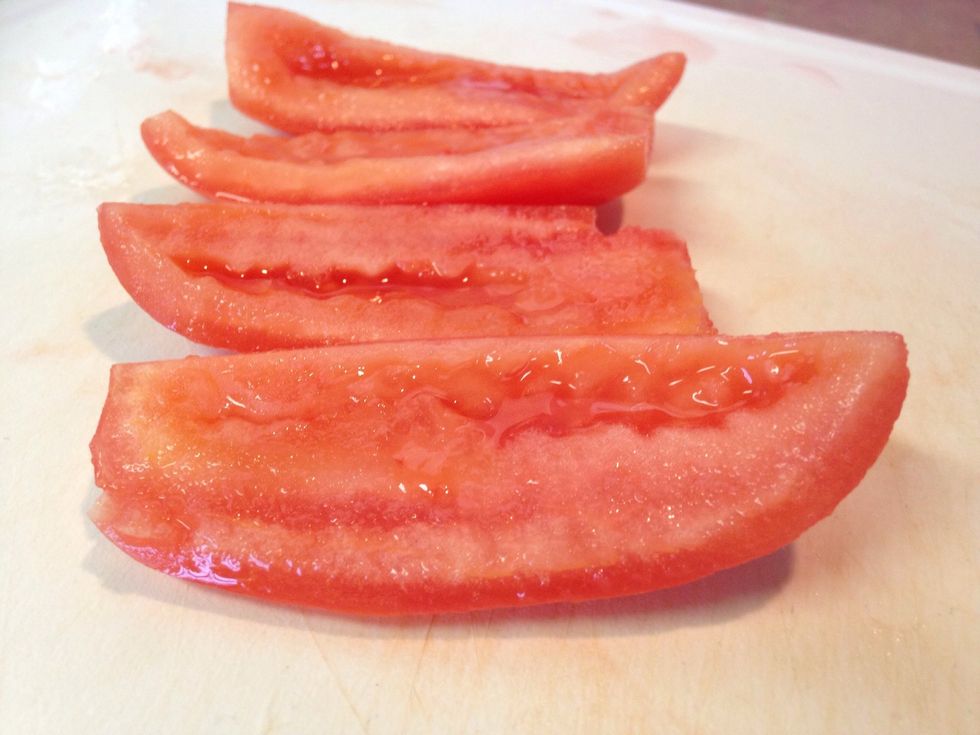 Cut into quarters and remove the seeds.