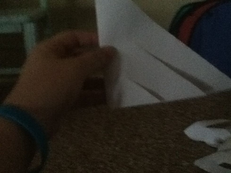 Cut into three flaps by cutting two more strips