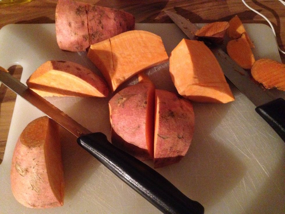 Cut it into eights. As sweet potato is very hard, you'll need a sharp, large knife.