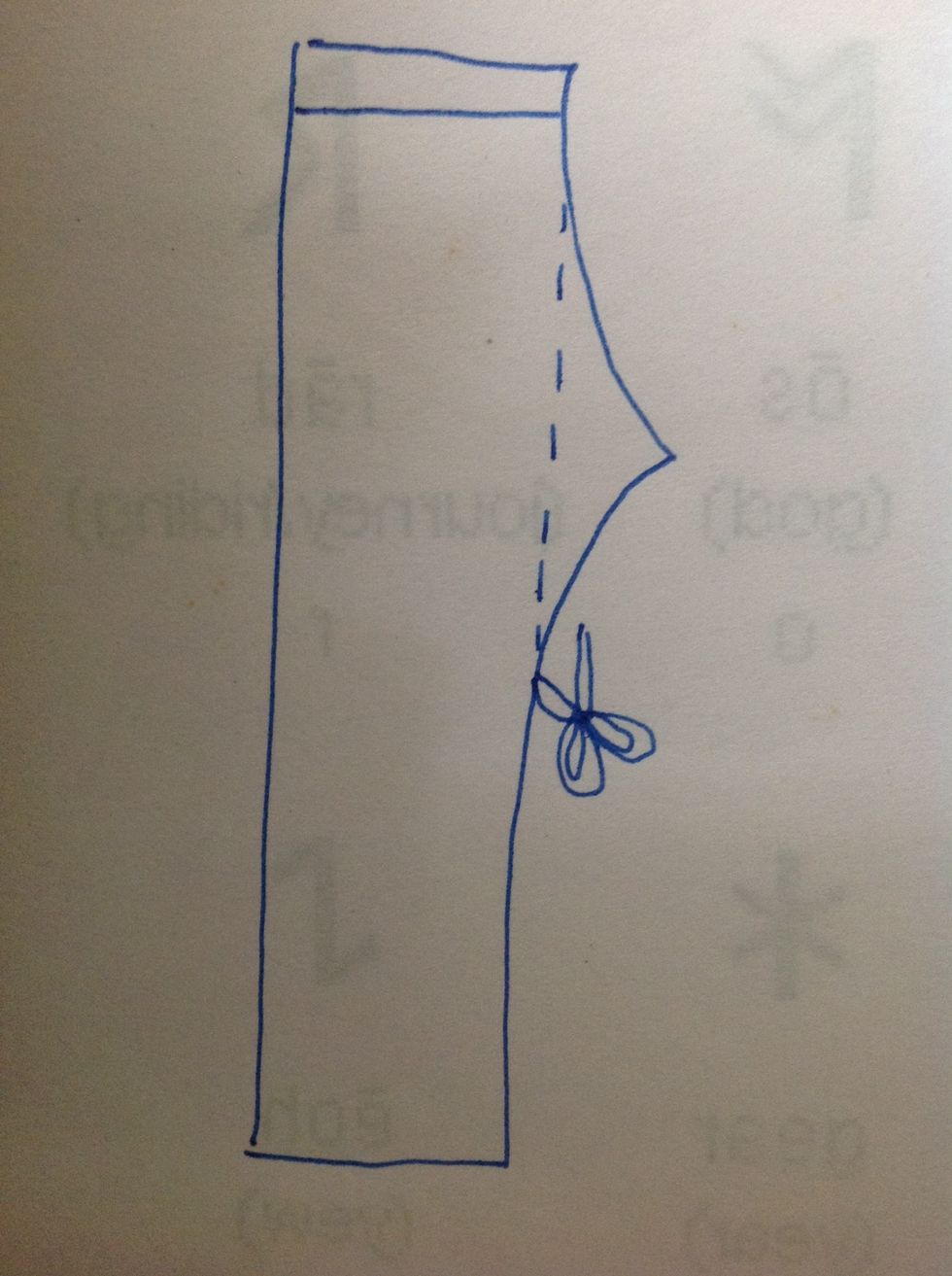 Cut it off, so you have a straight side to stitch.