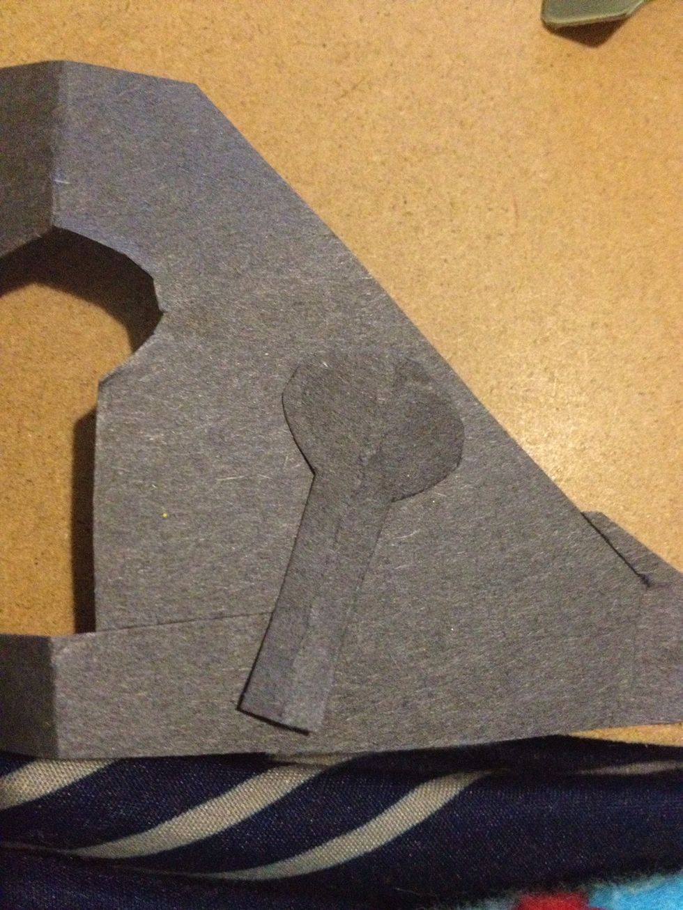 Cut it out, place it on another piece of black paper, trace, and cut it out once more.