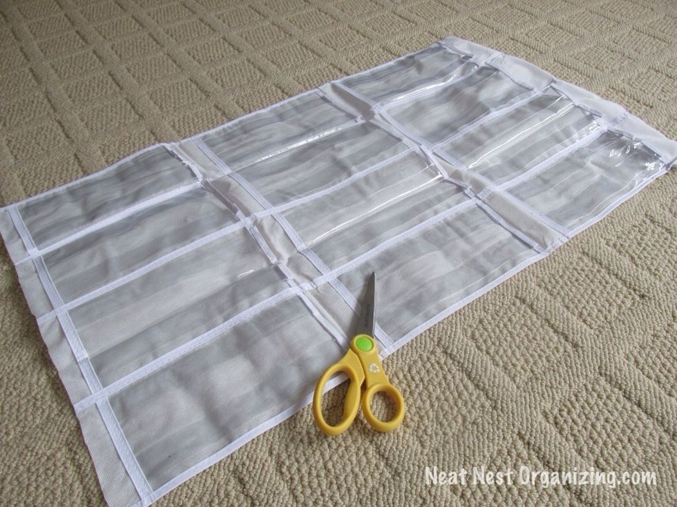 Cut it so that 3 full rows of pockets remain. Discard the rest.