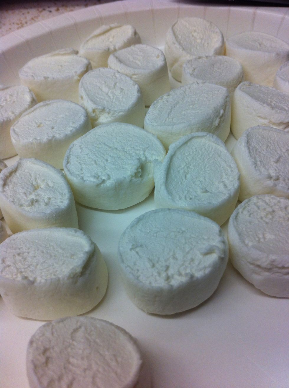 Cut jumbo marshmallows in half.