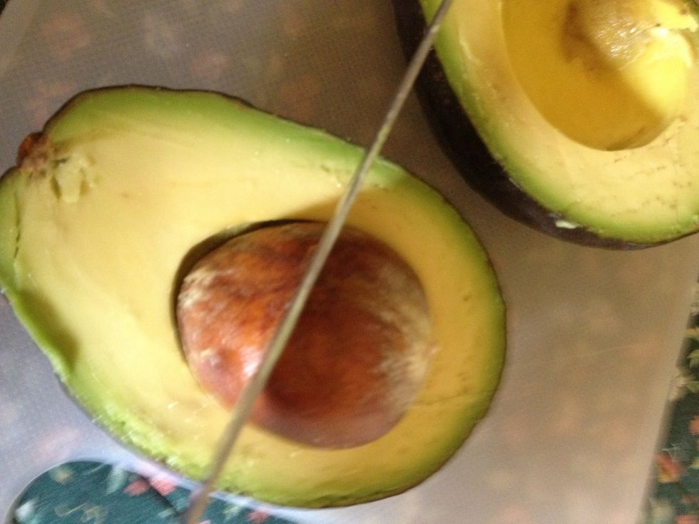 Cut large Avocado in half and remove pit