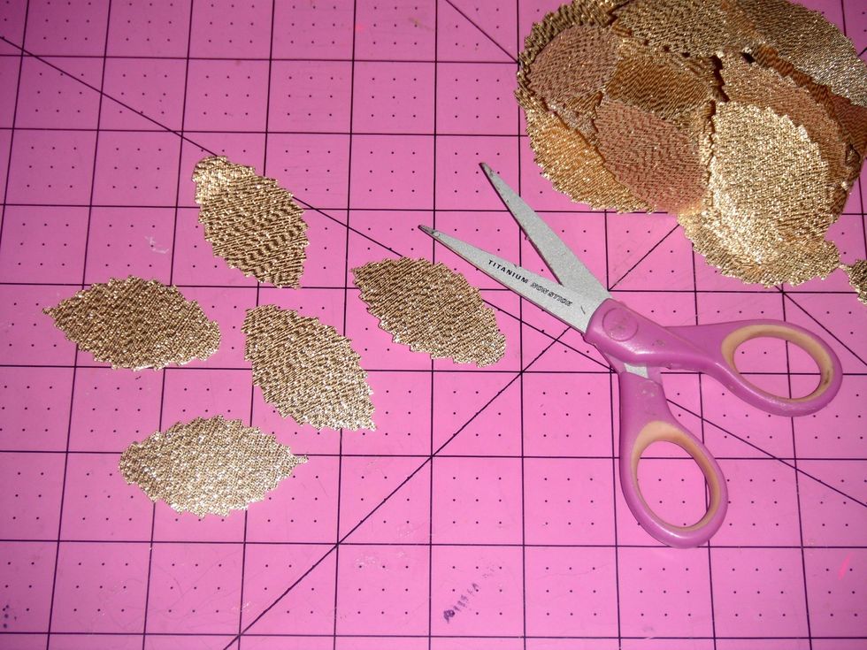 Cut leaves from gold faux suede leaf ribbon. You will need from 5 to 10 leaves per flower, depending on how much you want to layer them.