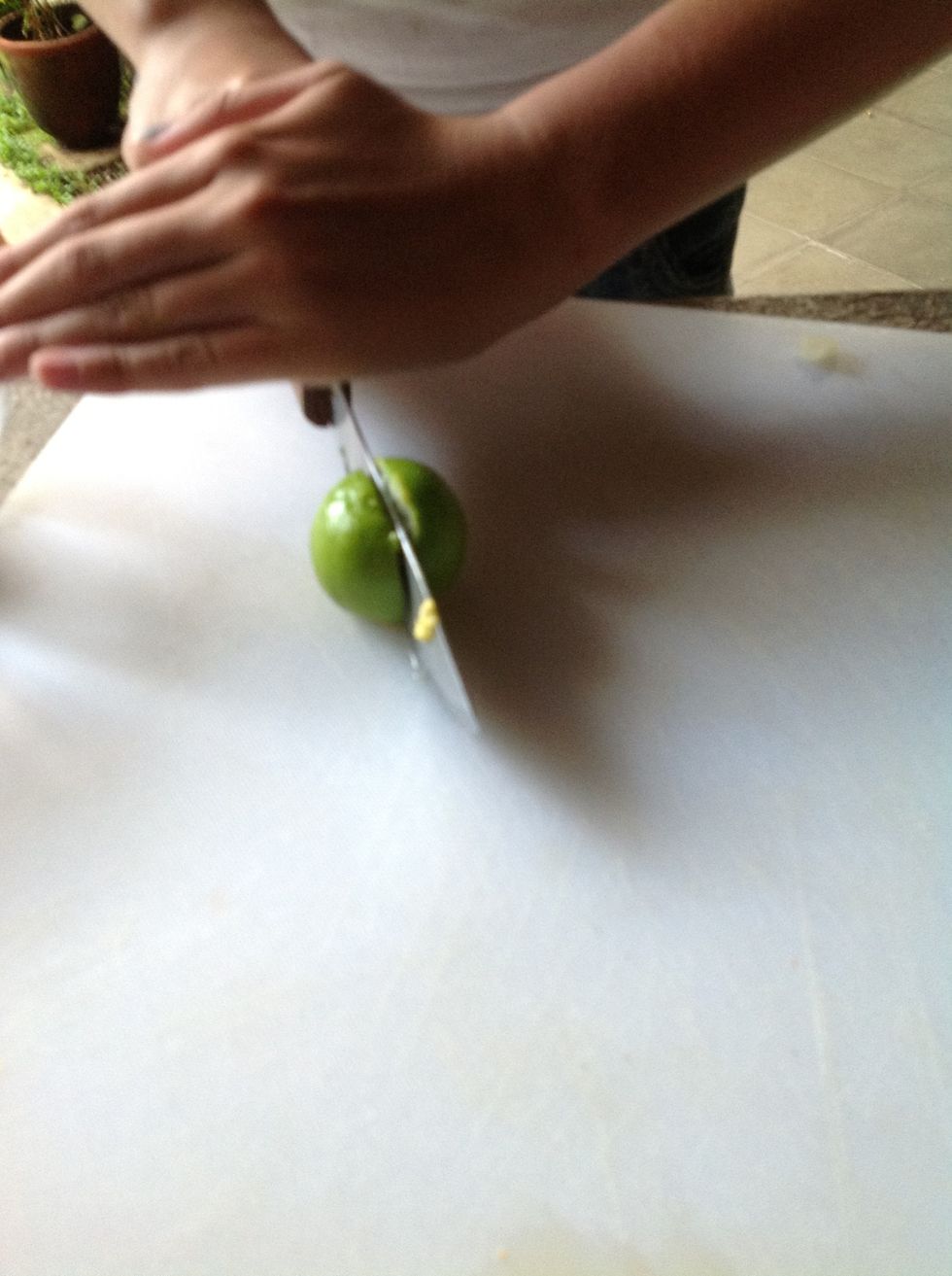 Cut lime in half useing a knife.