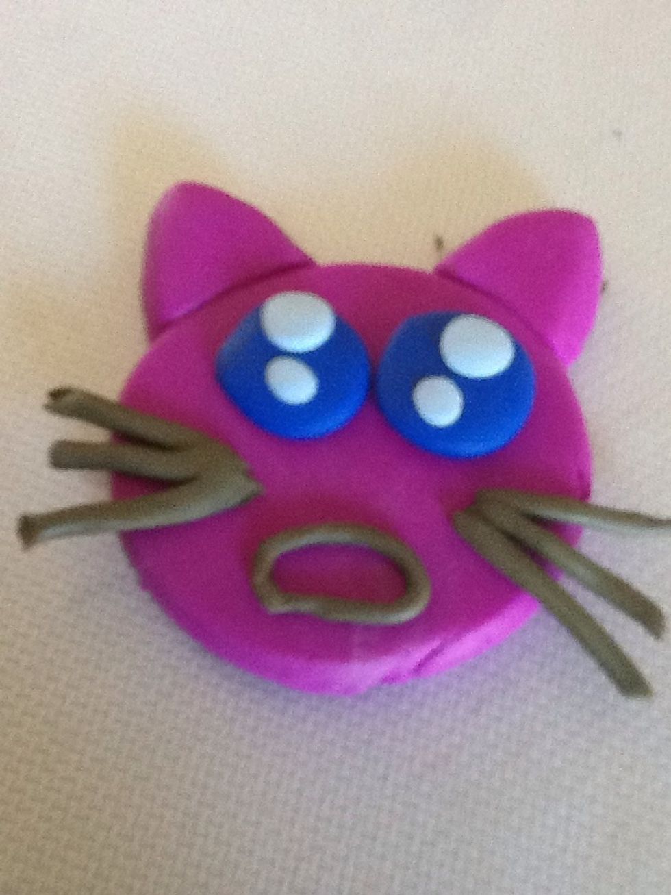 Cut little pieces of clay and attach them to the face