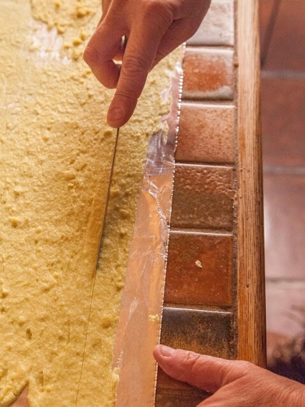 Cut long strips down the length of the batter on the foil.
