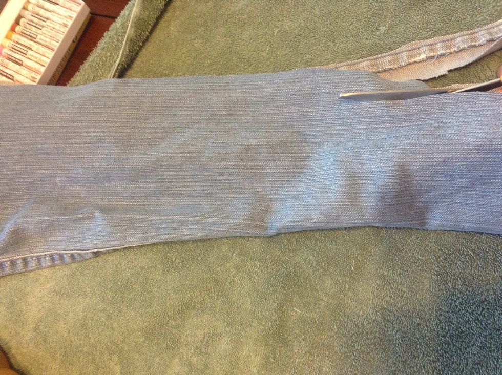 cut long strips of fabric from the jeans
