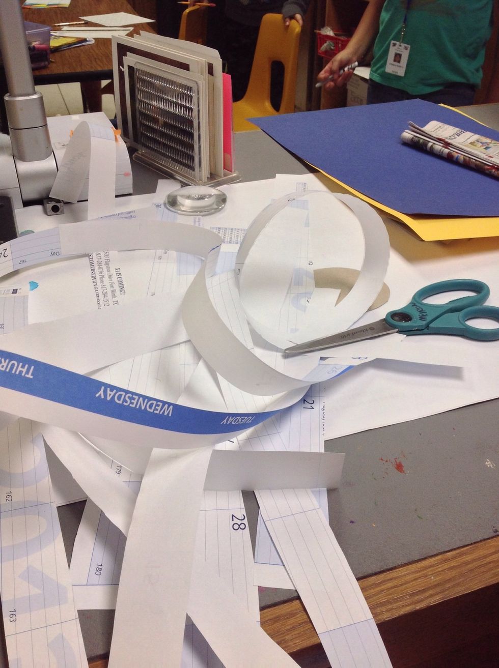 Cut many strips of paper.