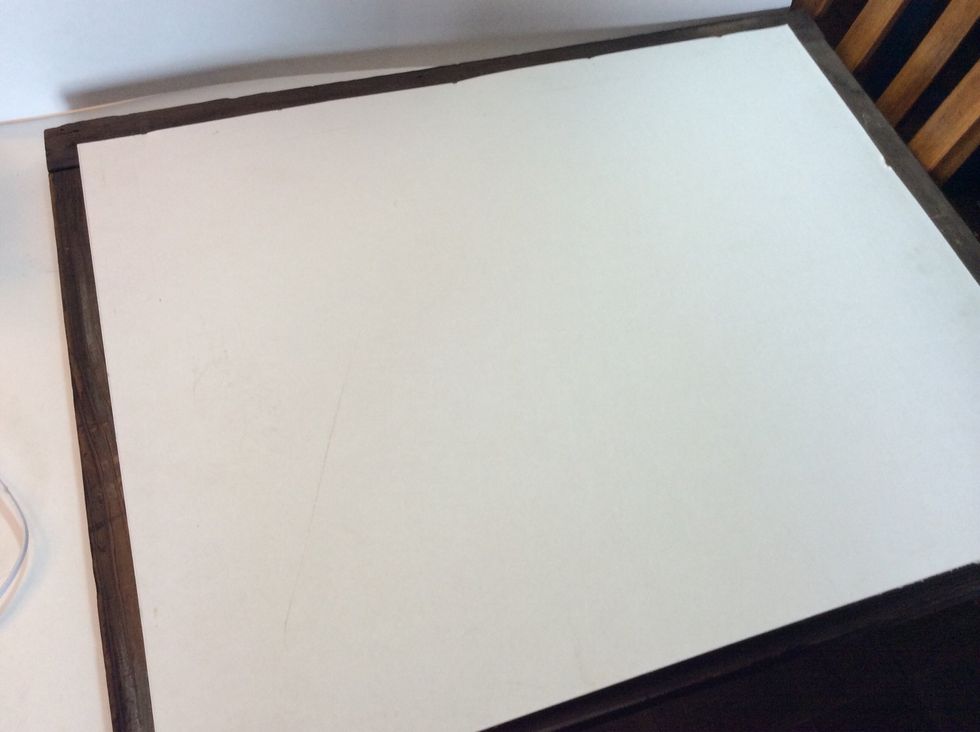 Cut mat board or poster board to cover the back.