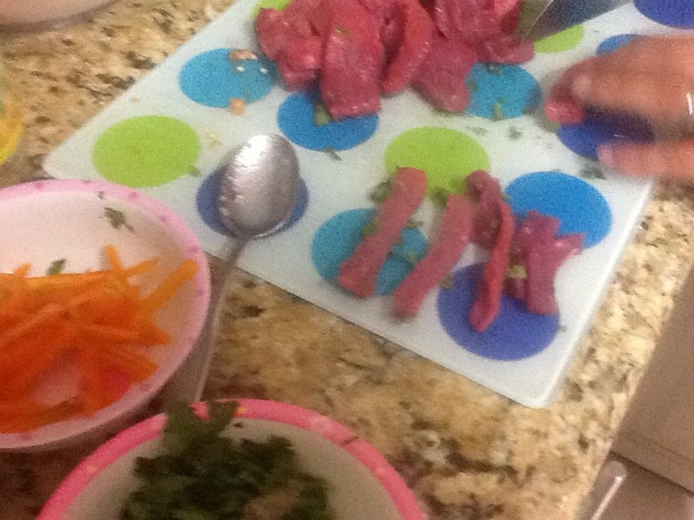Cut meat into thin strips as illustrated.