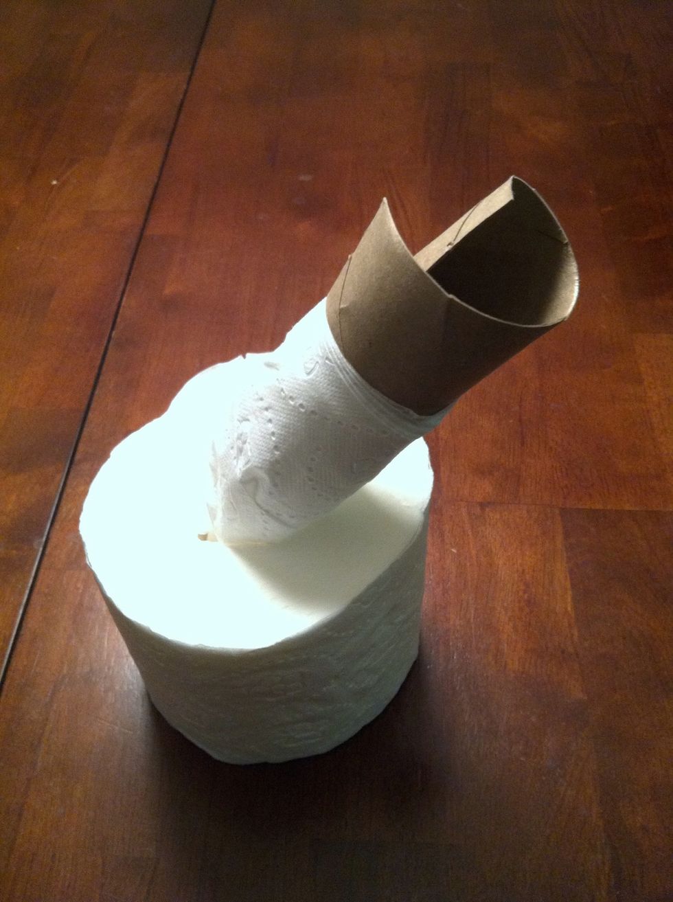 cut middle cardboard in tissue roll, and pull out with scissors