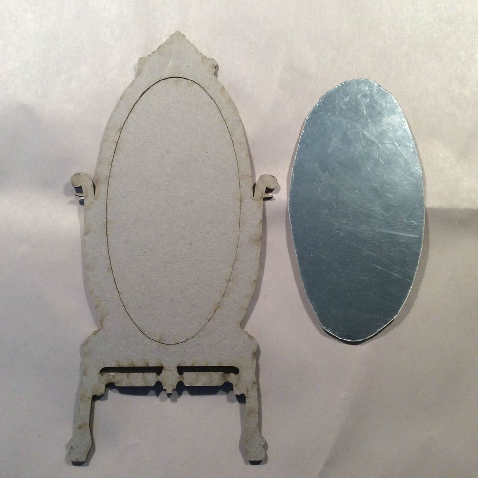 Cut my mirrored sheet to fit the inside of my floor mirror and set aside.