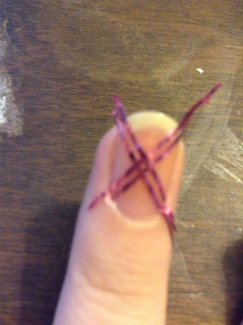 Cut narrow pieces if you're using regular tape, and make an 'x'. If you do use nail tape, be careful not to get paint in 'x' spaces.