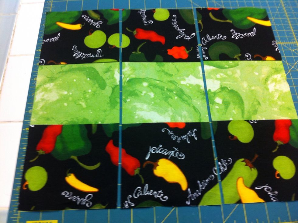 CUT. Now align on cutting mat and cut three 4-1/2" wide strips.