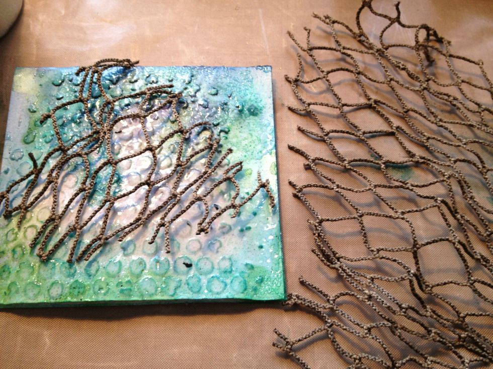 Cut of a piece of fish net. I purchased this at my local craft store.