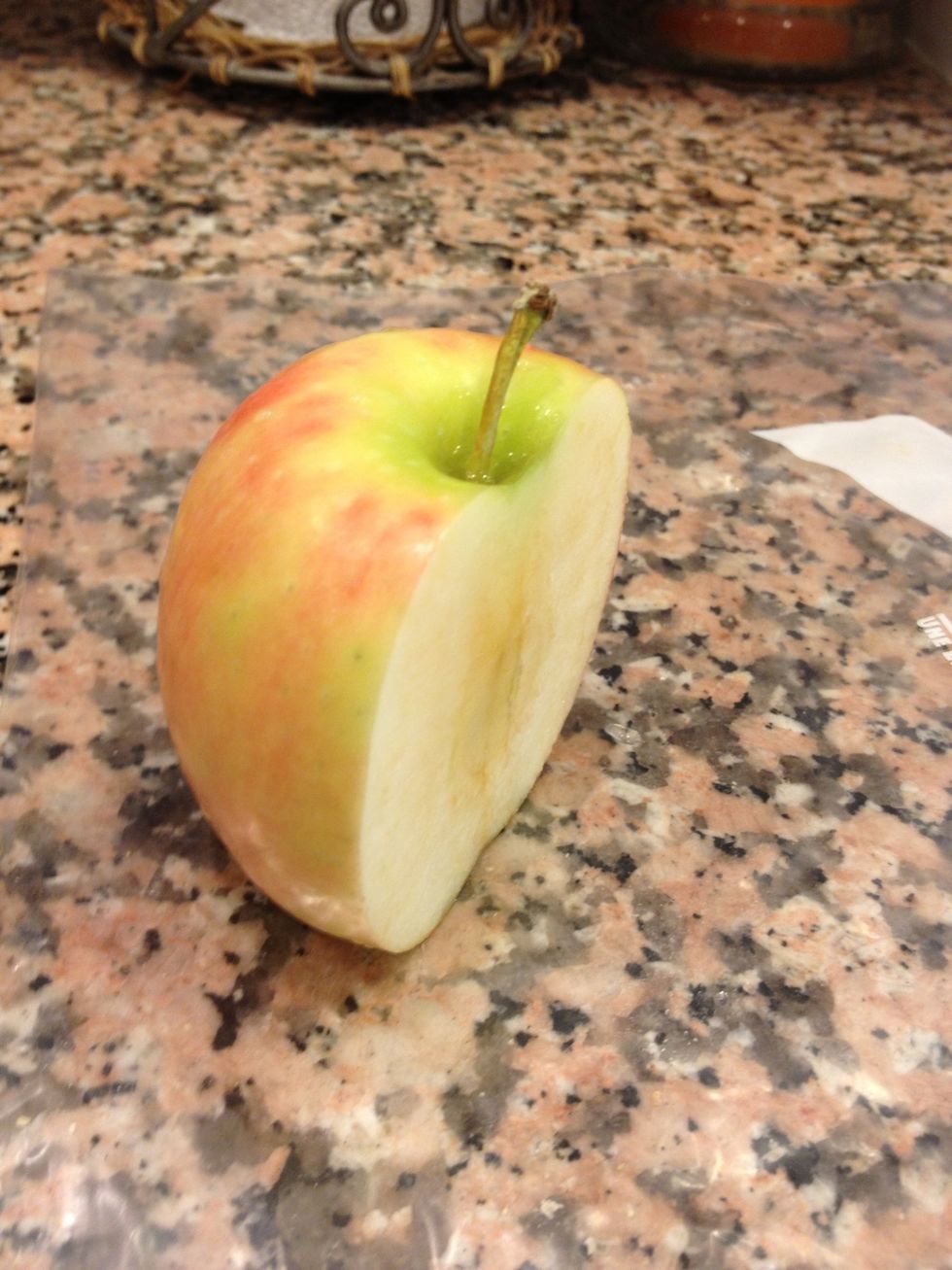 Cut off 1/2 of an apple and slice it into thin half moon shaped pieces.