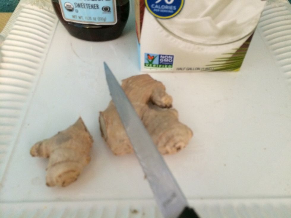 Cut off a piece of ginger root.