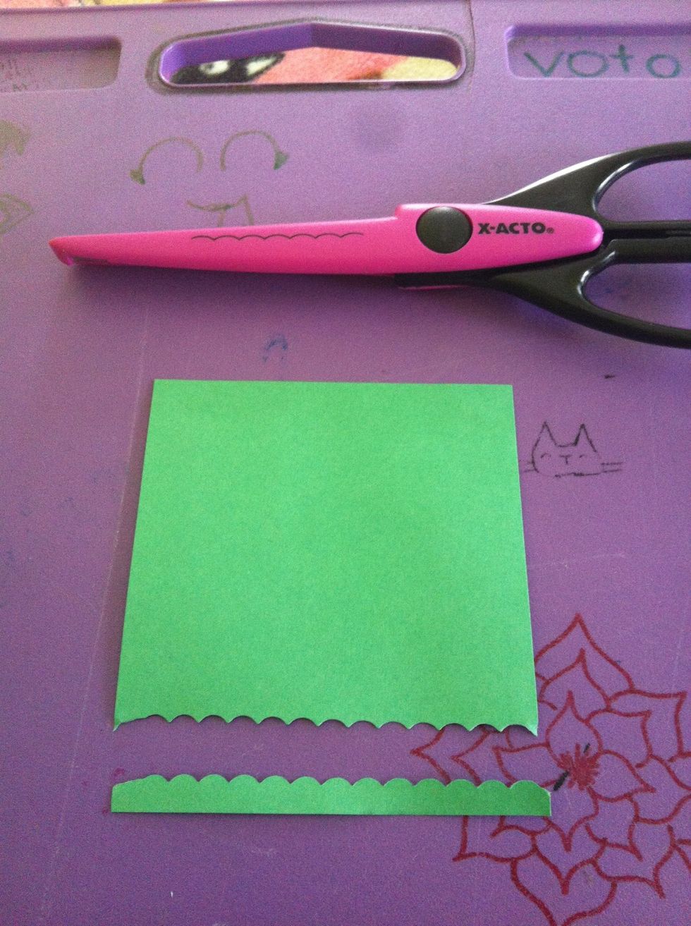 Cut off a thin strip of your green as shown. You can use any scissors you wish. It looks good with zigzag scissors but I misplaced mine:(