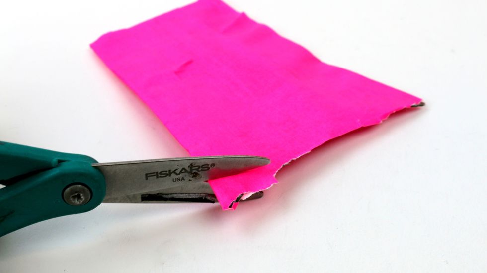 Cut off any excess newspaper if necessary.