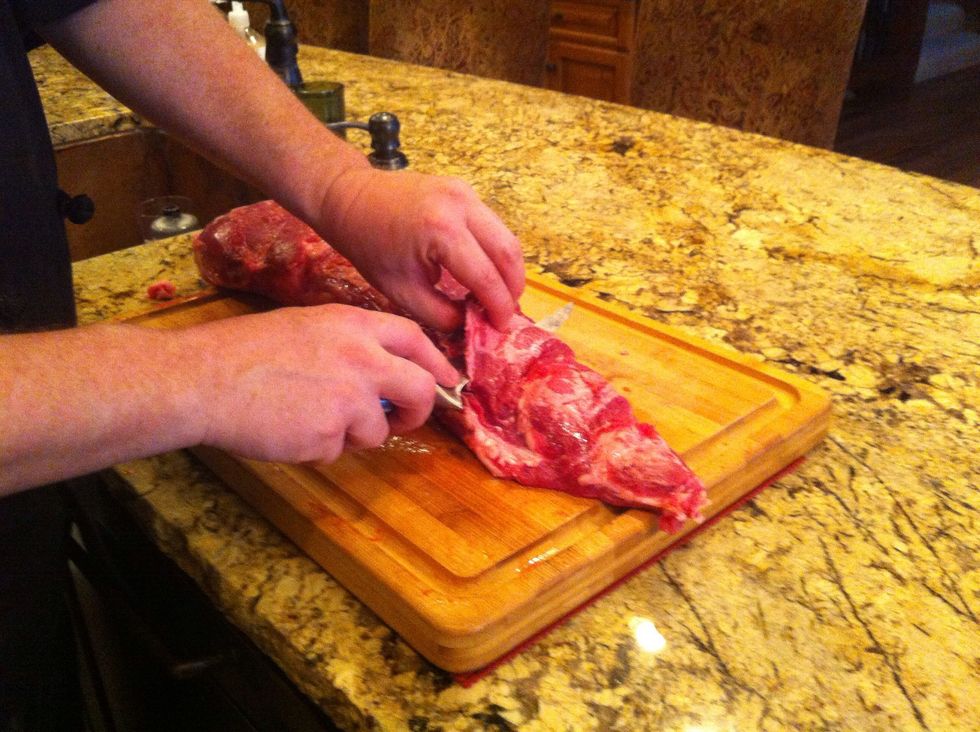 Cut off each of the fatty lumps there, making sure to cut each one off level with the last, leaving a smooth, uniform surface free from bumps and gouges.