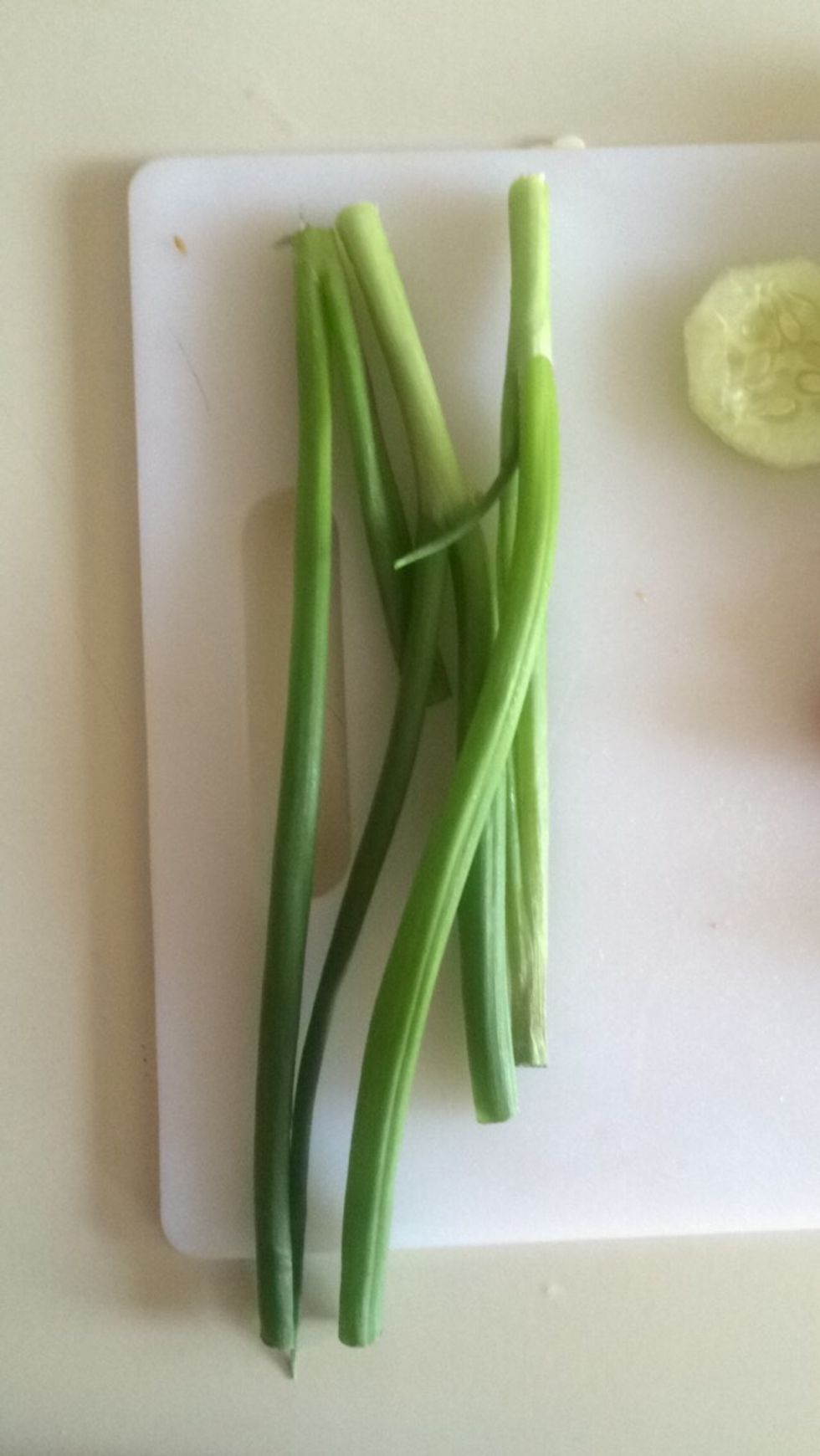 Cut off ends of green onions