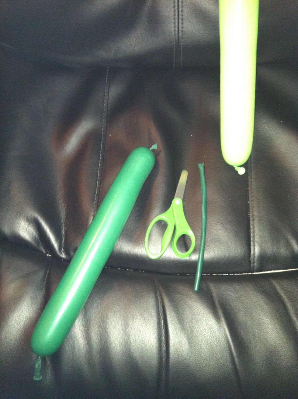 Cut off excess balloon (from the short one only) after tying off