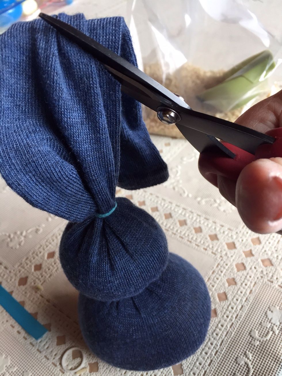 Cut off excess end of sock...