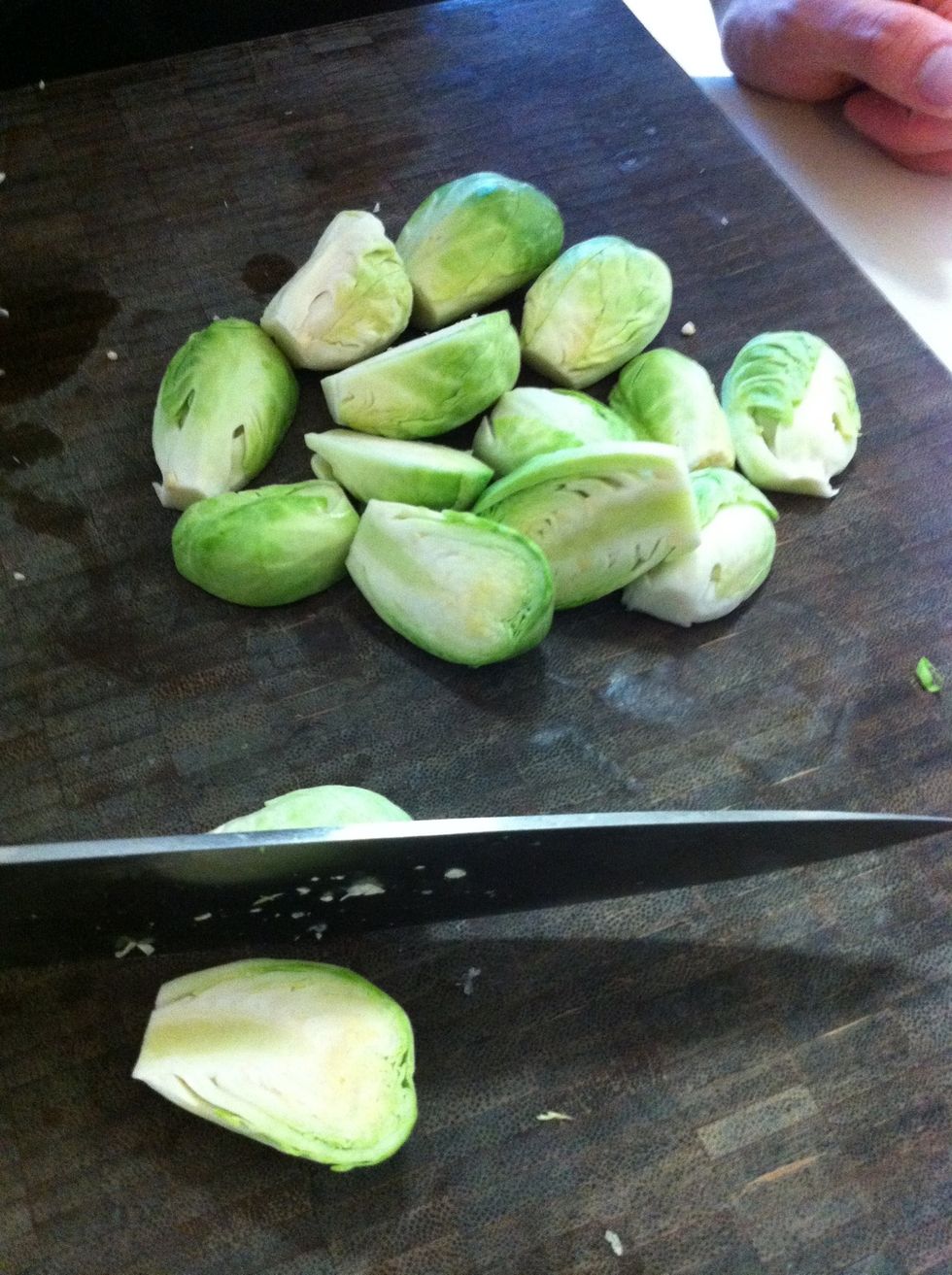 Cut off excess stem and slice the sprout in half